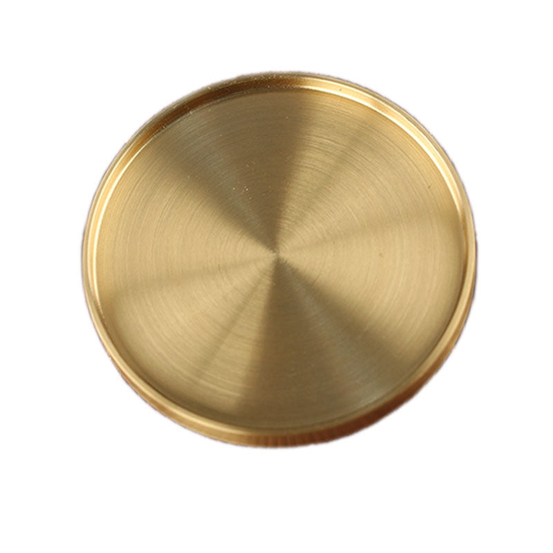 Solid brass coaster for drinks.