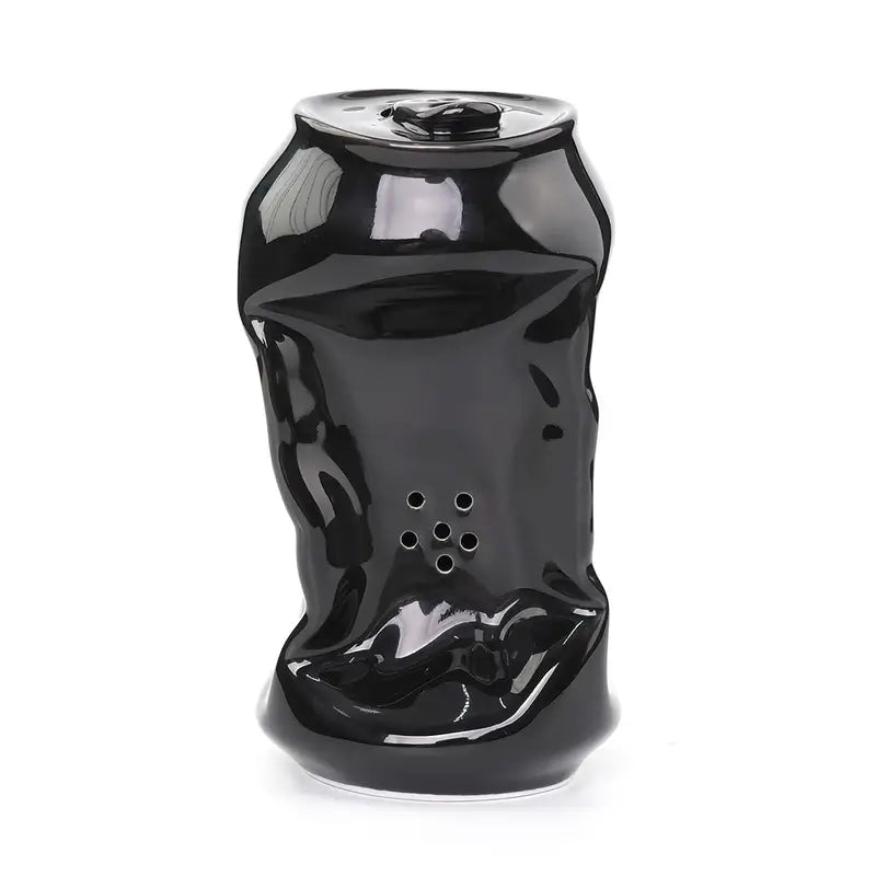 A ceramic black soda can pipe.
