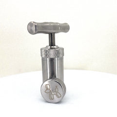 Pollen press made of heavy duty stainless steel.