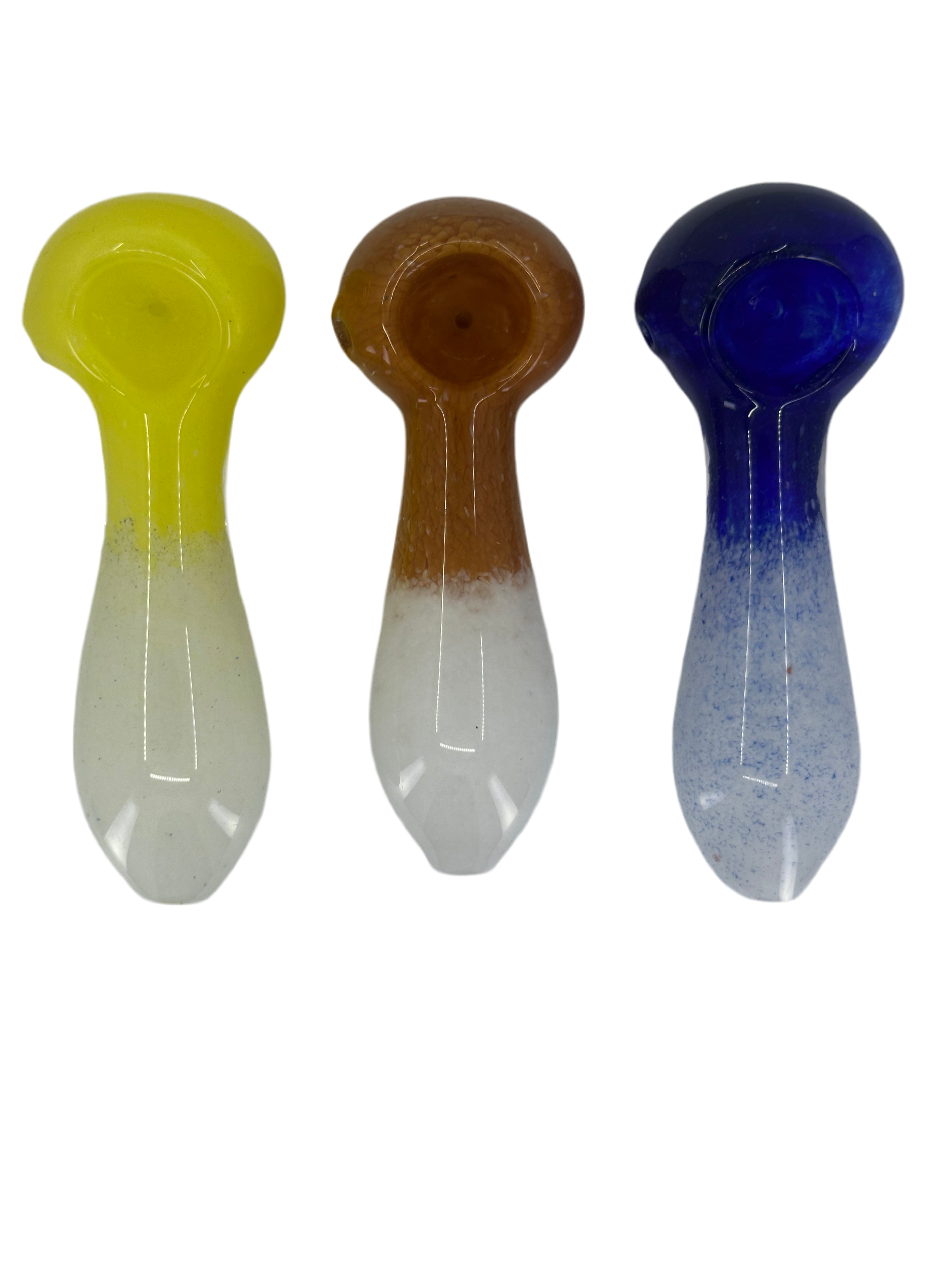 Three colorful plastic spoons on a white background