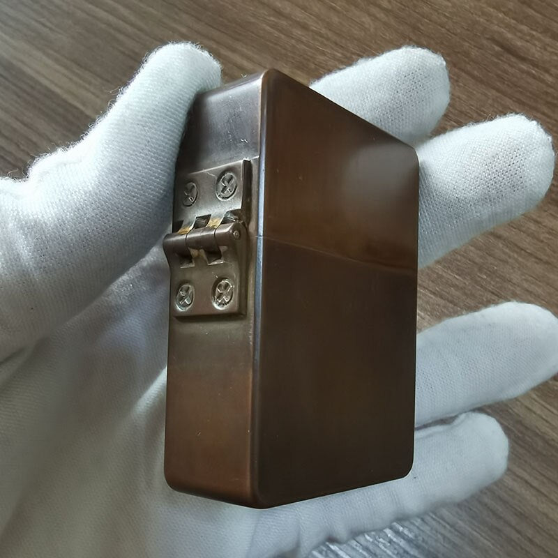 A brass copper heavy duty lighter.