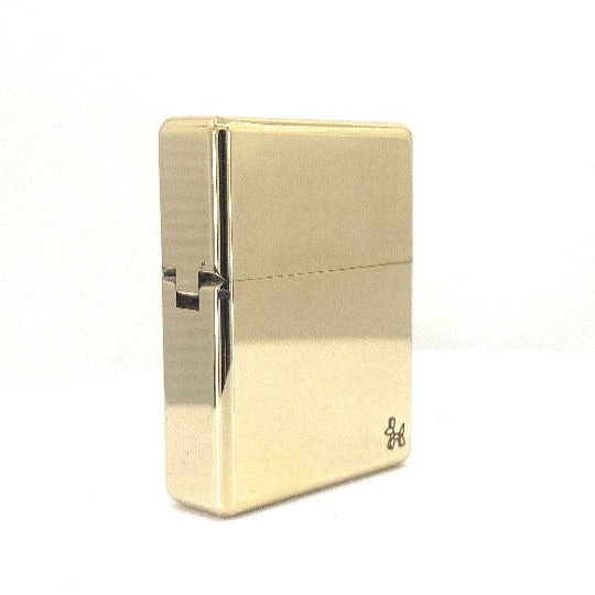 A gold vintage brass lighter.