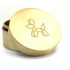 A brass weed grinder with a puffy puppy logo.