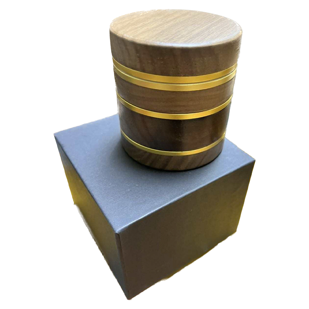 Large custom four piece natural walnut grinder with box.