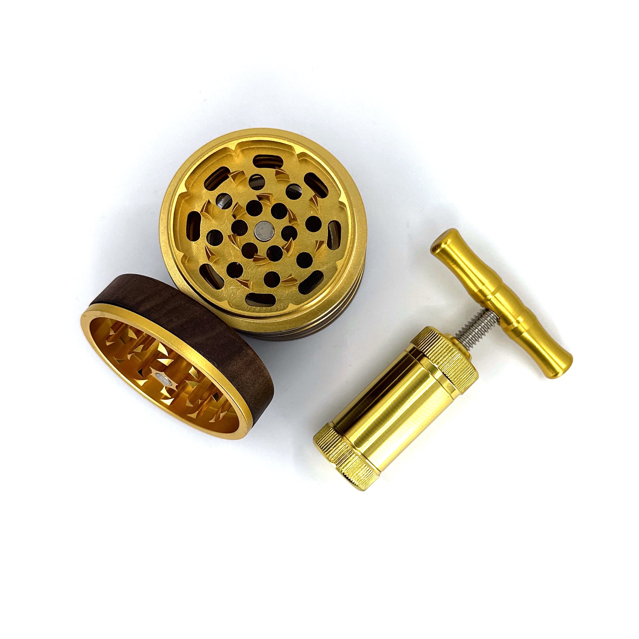 Gold four piece walnut spice grinder for weed and gold pollen press.