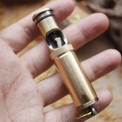 A vintage brass kerosene trench lighter.
