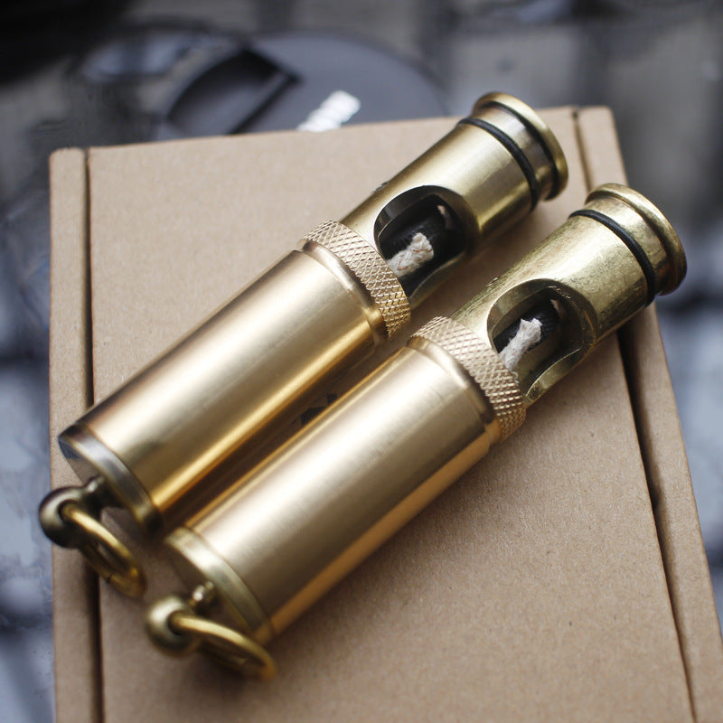 Two vintage brass kerosene trench lighter.
