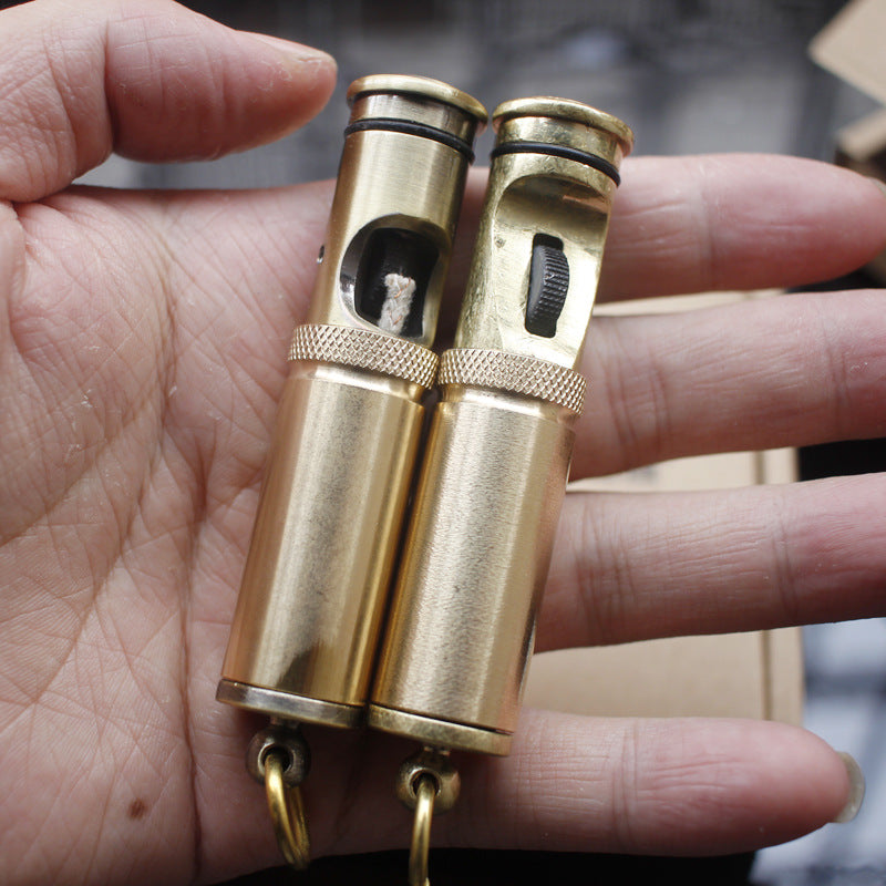 Two vintage brass kerosene trench lighter.