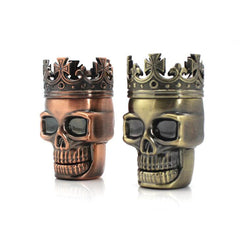 Gold and bronze skull weed grinder and storage.