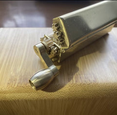 Solid brass tobacco joint rolling machine with lever.