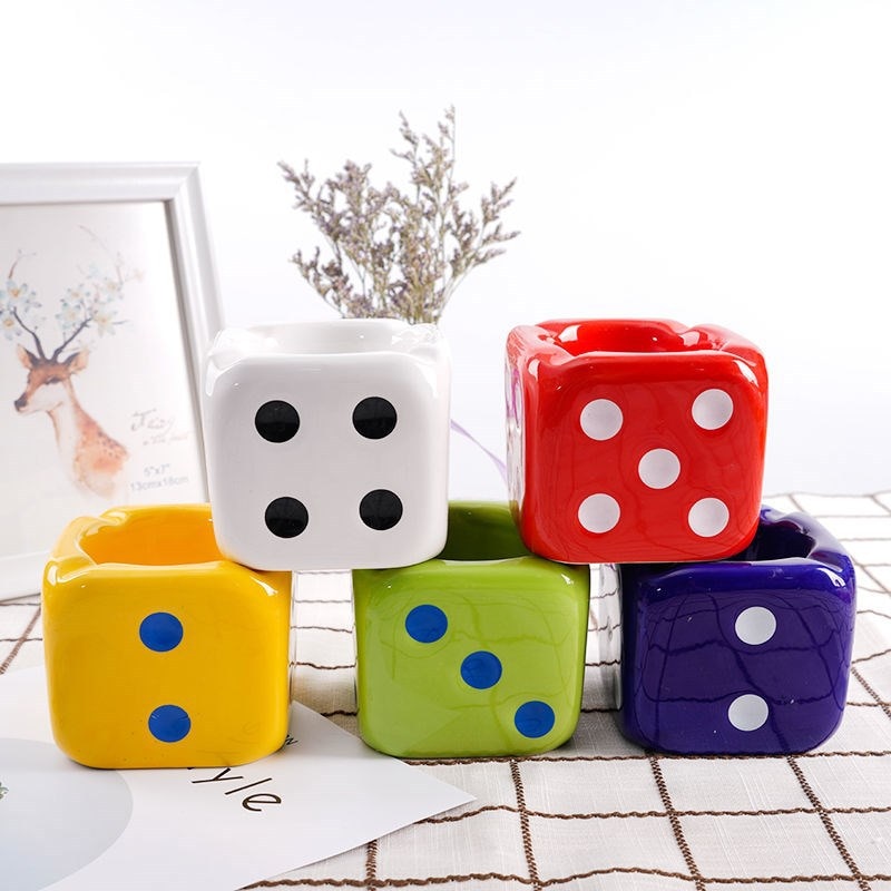 White, red, yellow, green and blue dice ashtray.