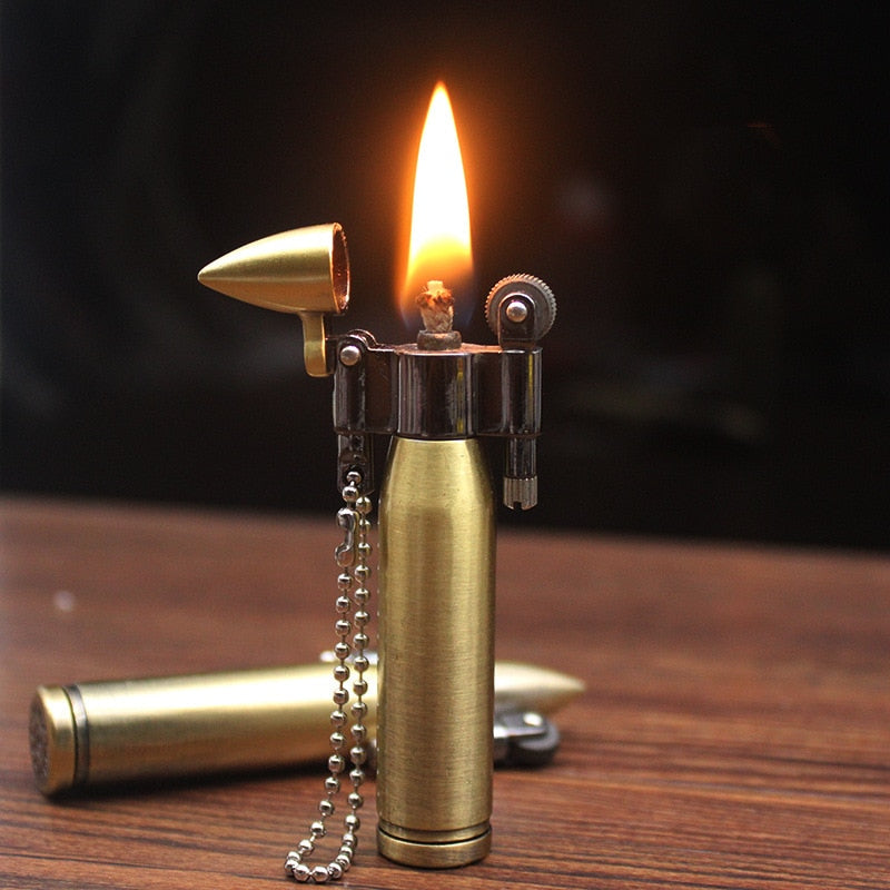Brass bullet shaped kerosene steampunk lighter keychain.
