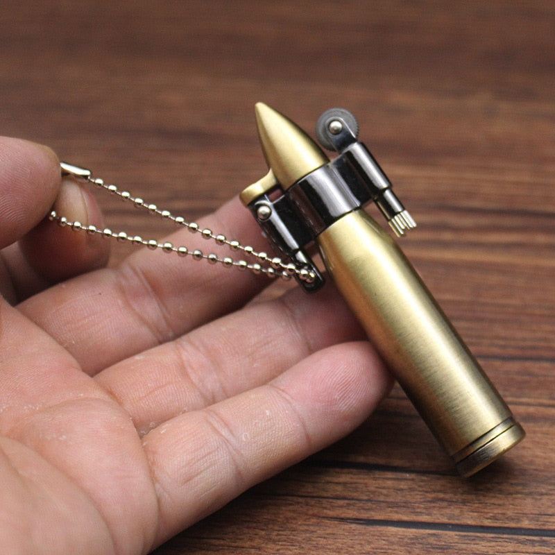 Brass bullet shaped kerosene steampunk lighter keychain.