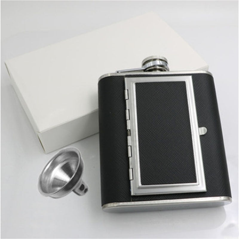 A black whiskey flask with a cigarette compartment and a white package box.