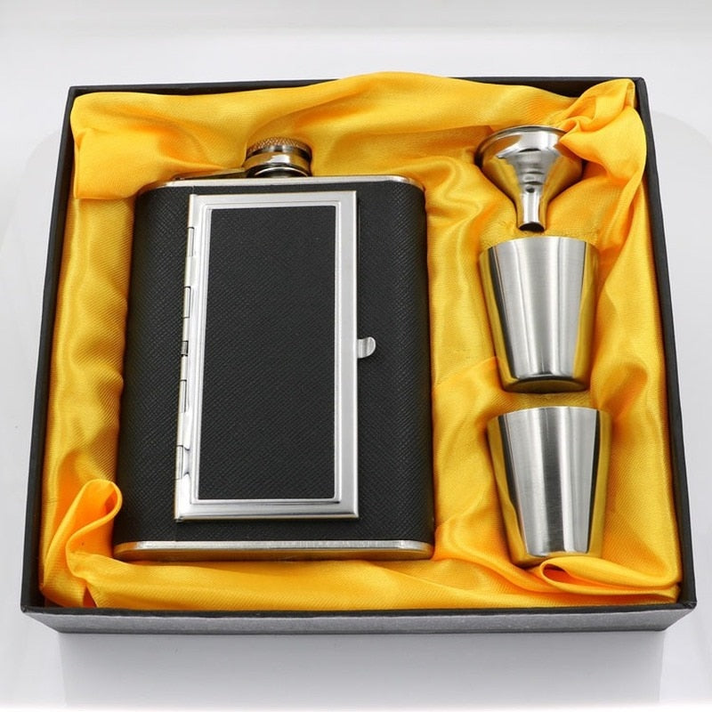 A whiskey flask with a cigarette compartment and two stainless steel shot glasses.