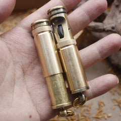 Two vintage brass kerosene trench lighters.