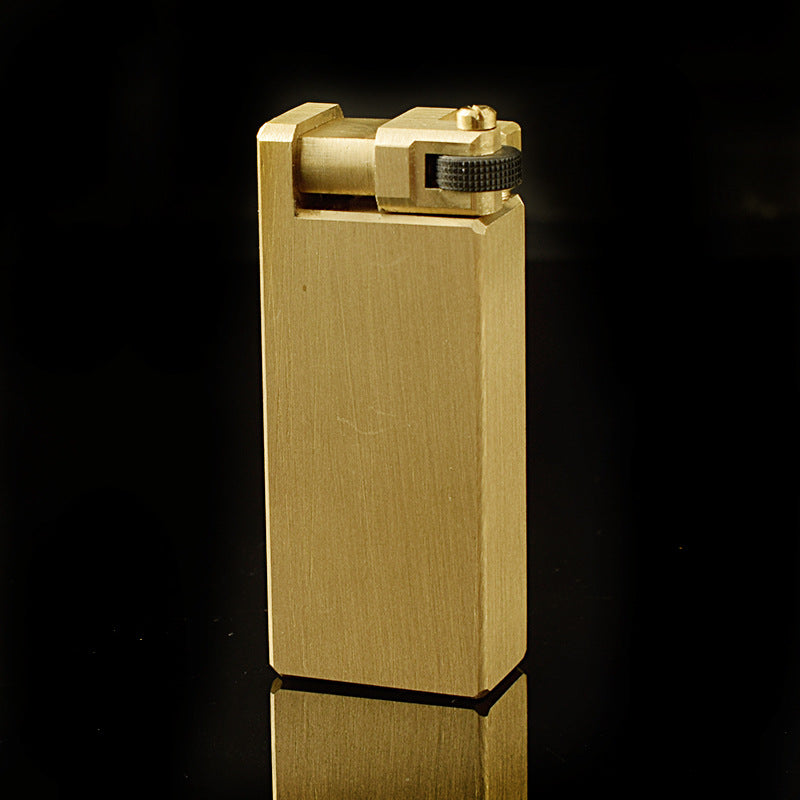 A gold brass heavy duty kerosene trench lighter.
