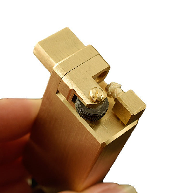 A gold heavy duty kerosene trench lighter.