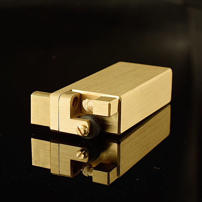 A gold brass heavy duty kerosene trench lighter.