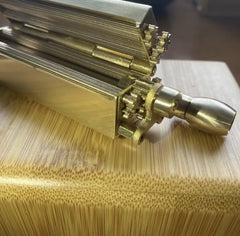 Solid brass tobacco joint rolling machine with lever.