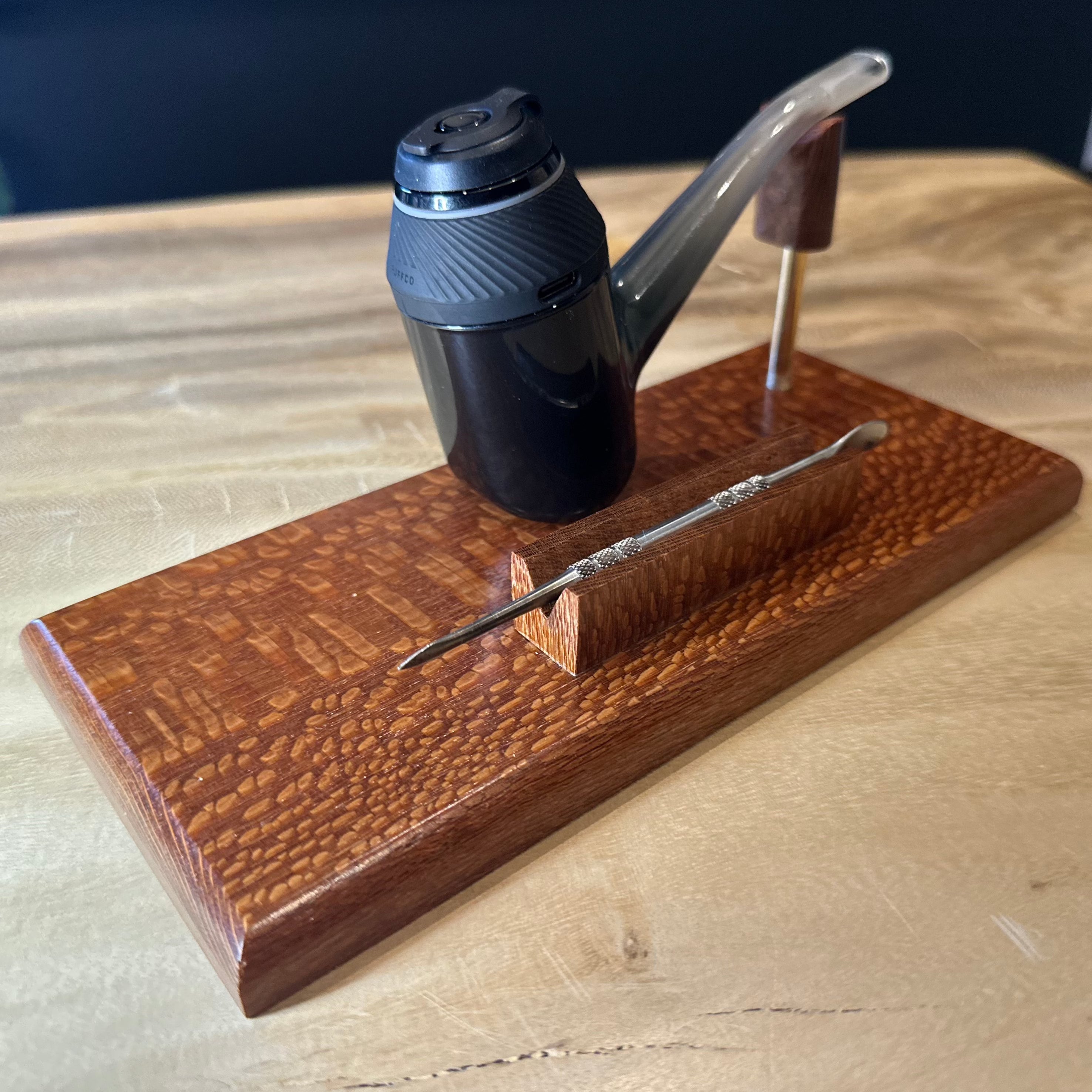 A dab holder stand and pipe.